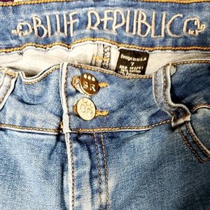 Blue republic jeans that have embroidered flowers on the legs of them. 7 in size